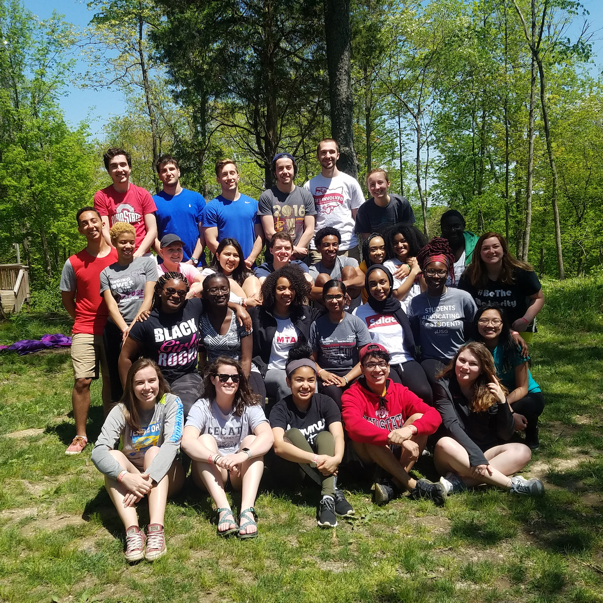 A group of students pose outside.