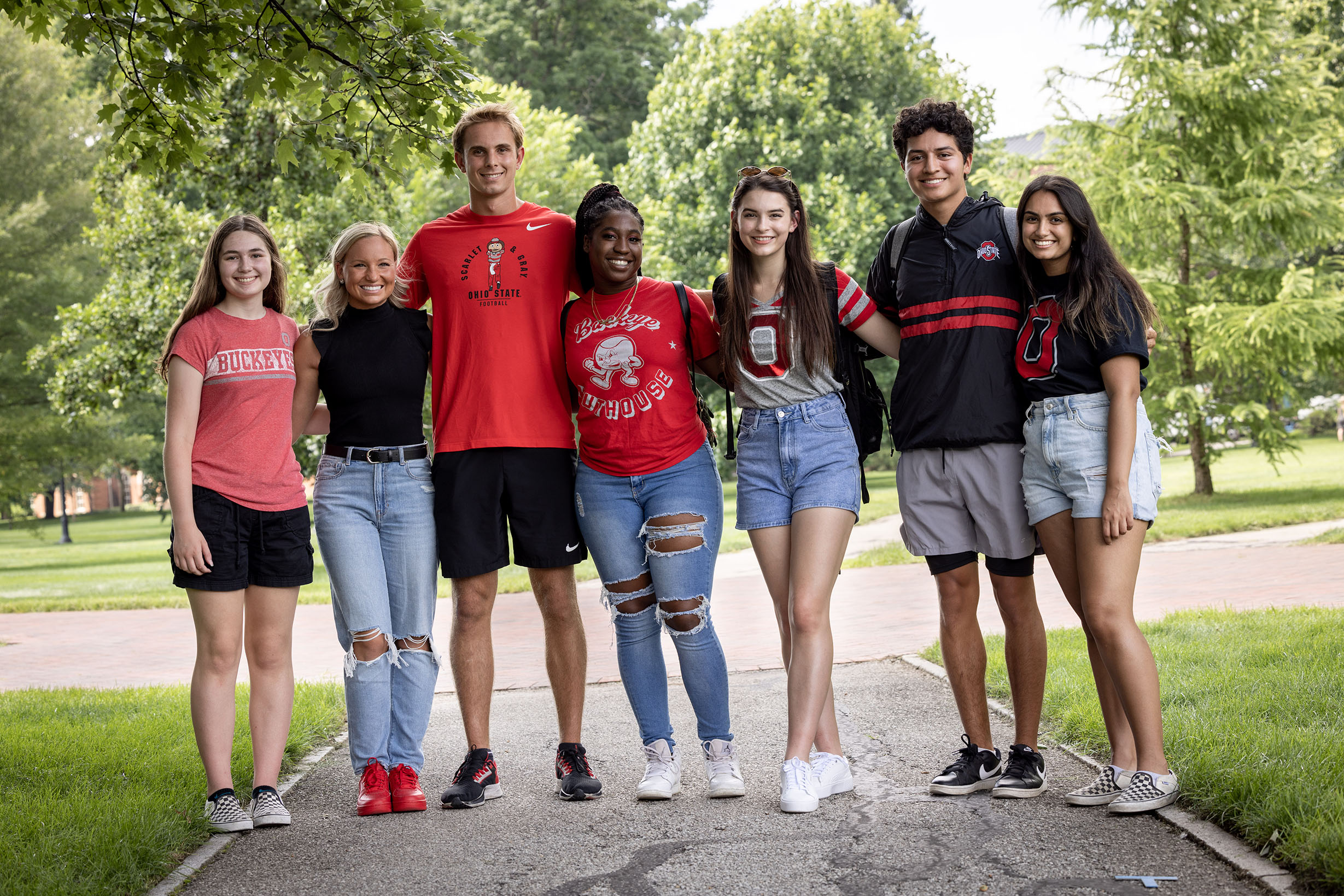 Group of students side-hugging on the oval