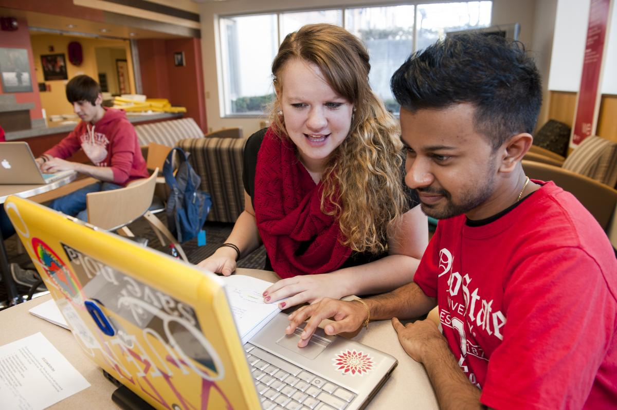 An advisor and student talk.